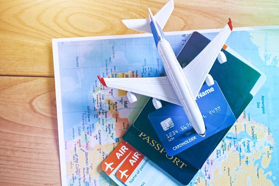 Air tickets and passports on world map for Vietnam visa application