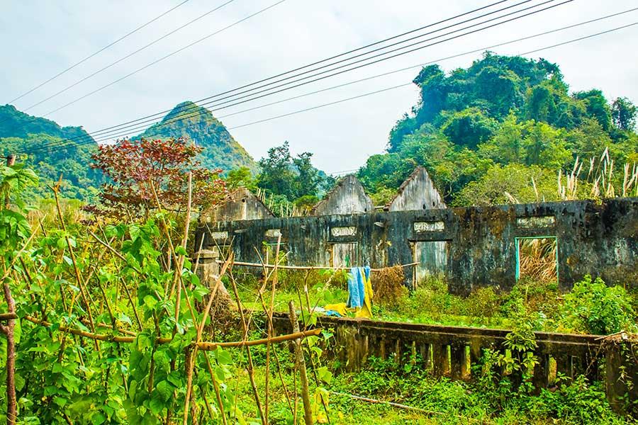 An old ruined farm building in the jungle of the Cat Ba National Park, Vietnam
