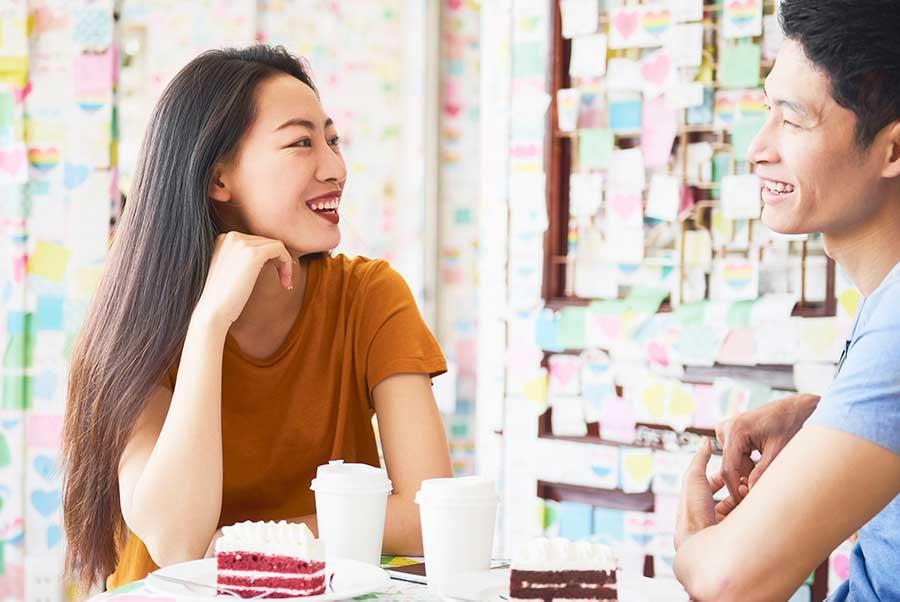 Vietnamese couple talking and looking at each other
