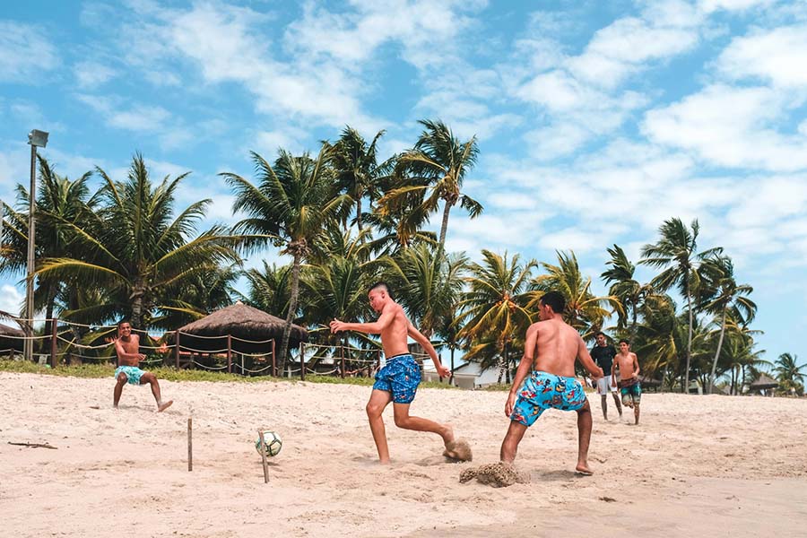 People playing football on the beach in Vietnam